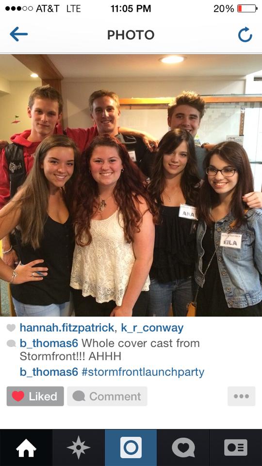 Fan and high school student who has taken Kate's writing classes, Bryce poses with the original Undertow cover models.